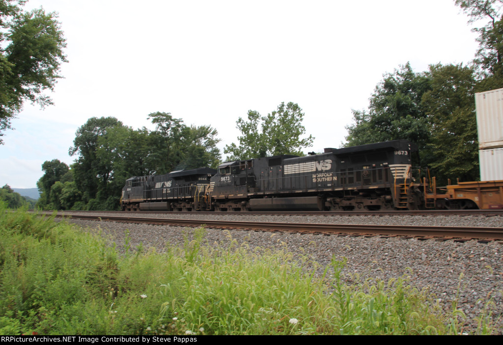 NS 8044 and 9673 take a westbound through MP116